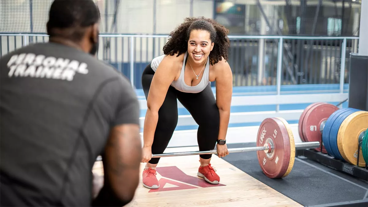 A one-on-one YMCA personal training session in progress