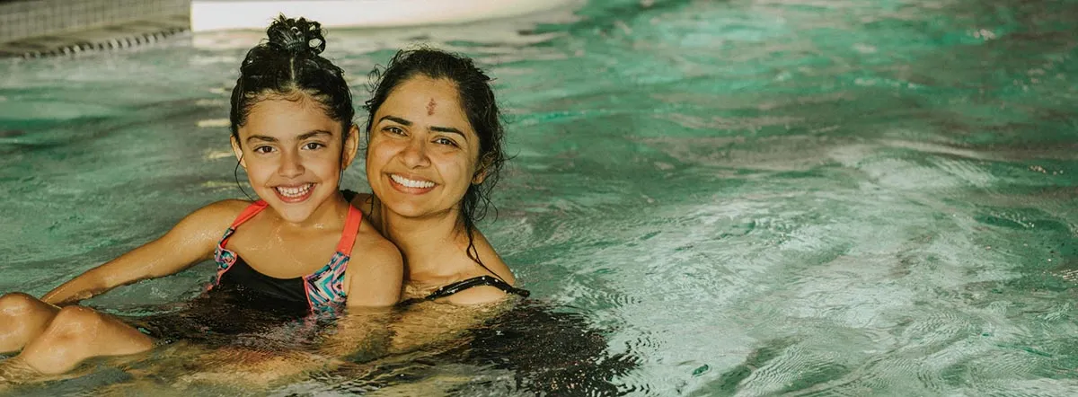 A mother and daughter participating in a swimming program at the Robert Lee YMCA in Vancouver.