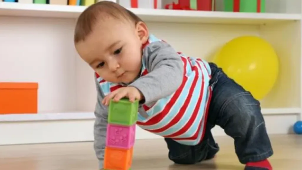Toddler building with blocks