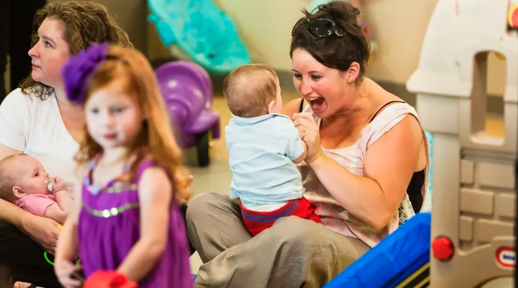 Mom playing with child