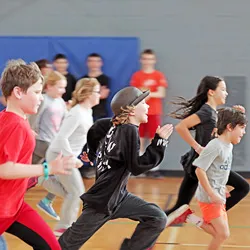 A group of children participating in the YMCA Mindful Monkeys mental wellness program for kids