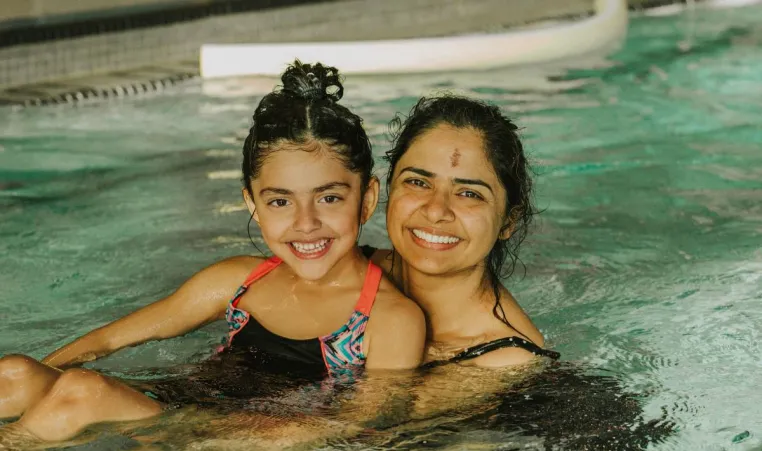 A mother and daughter swimming at the YMCA in Vancouver