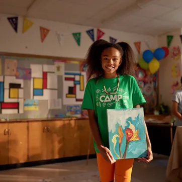 A child participating in a YMCA youth program in Canada that offers a third place for connection and socializing