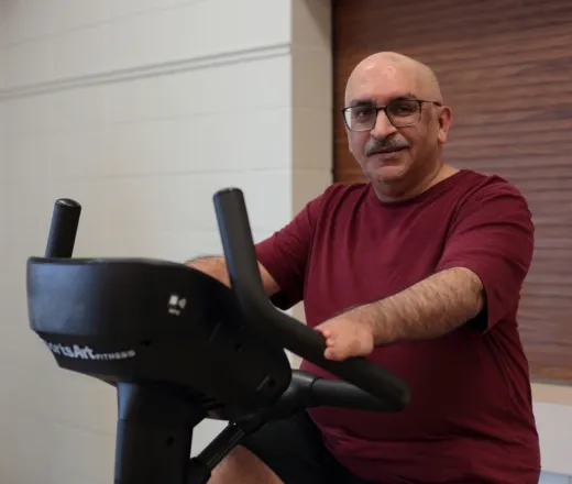 A man cycling on a stationary bike in the YMCA Healthy Heart program for cardiac patients in Greater Vancouver