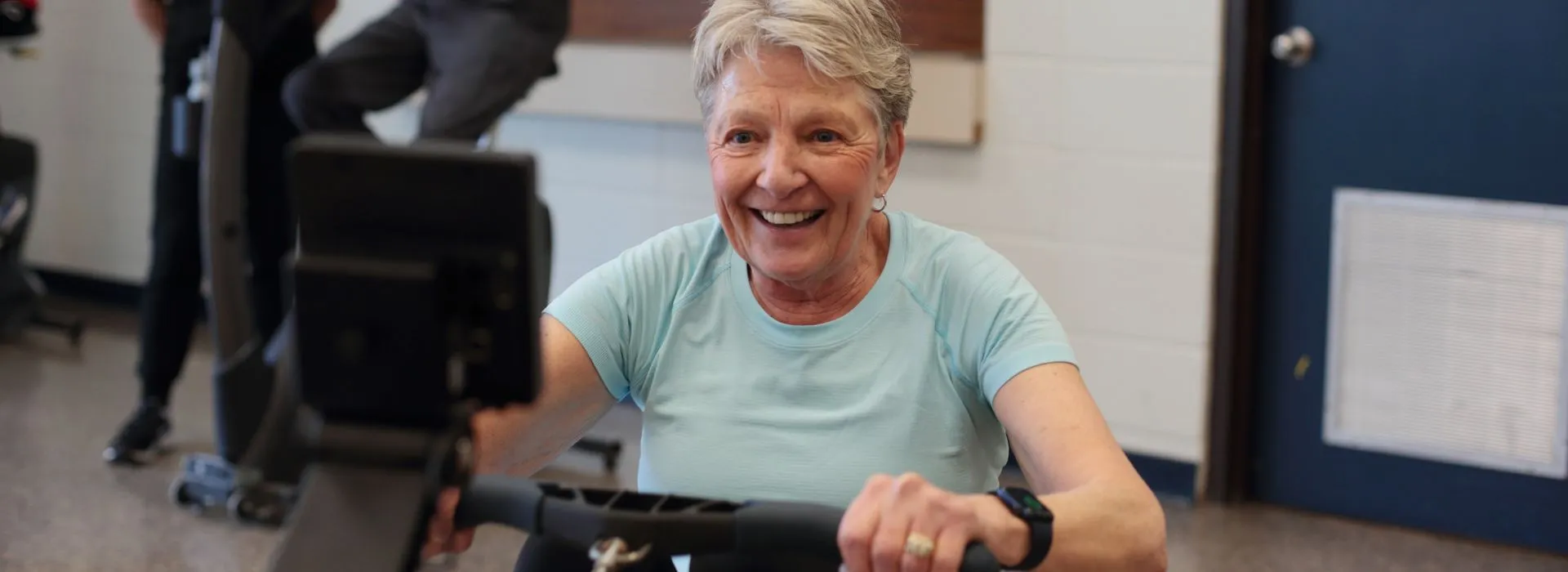 A participant using a stationary bike in the YMCA Healthy Heart program for cardiac patients