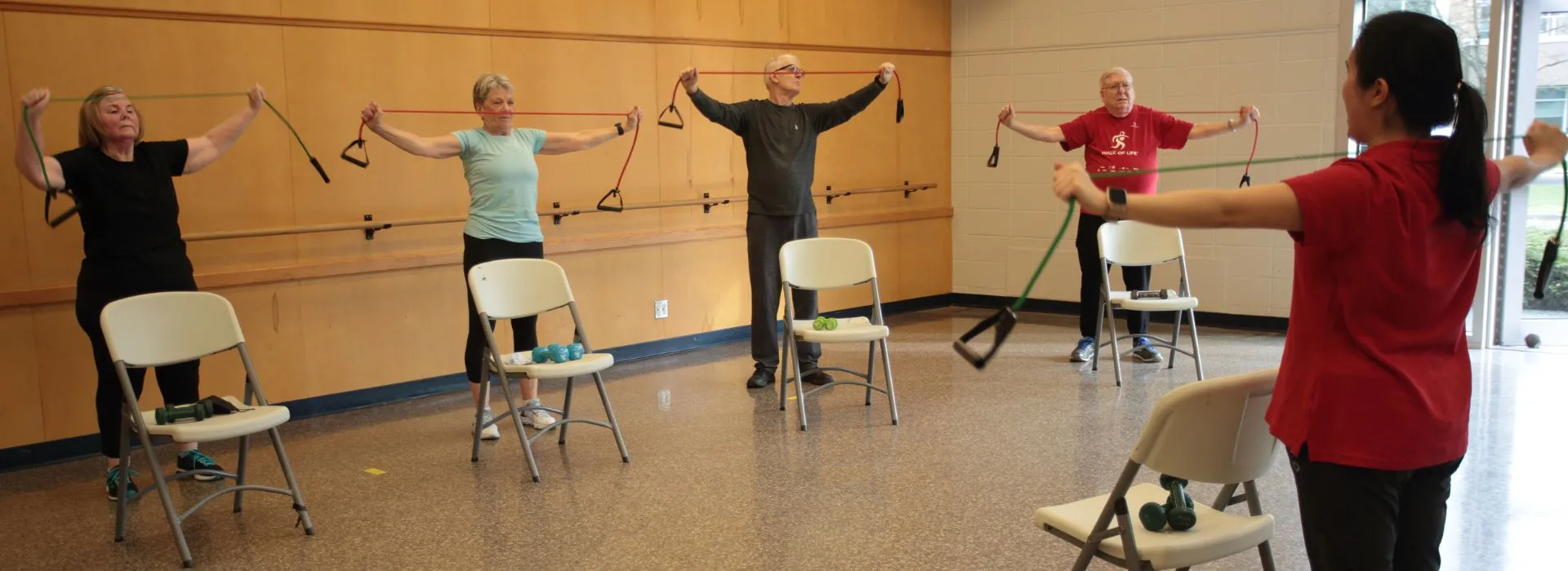 A group of people exercising with equipment in the YMCA Healthy Heart program for cardiac patients