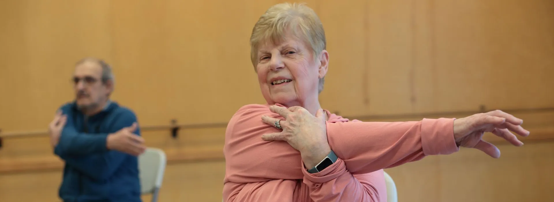 Participants of the YMCA Healthy Heart stretching in a guided group exercise session